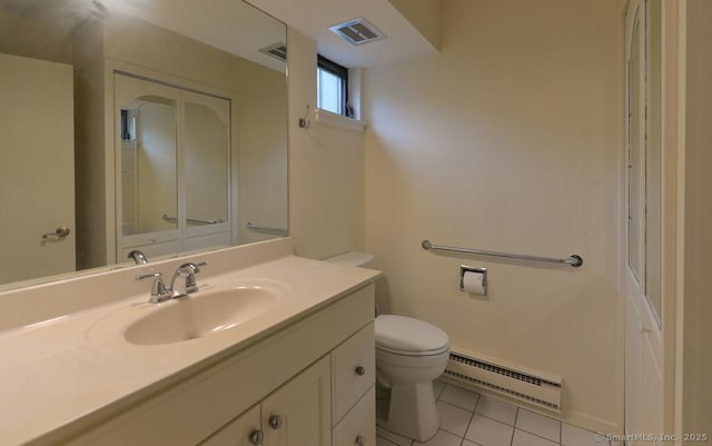 8 Heritage Vlg Unit D, Southbury, CT 06488 - bathroom with baseboard heating, toilet, vanity, and tile patterned floors