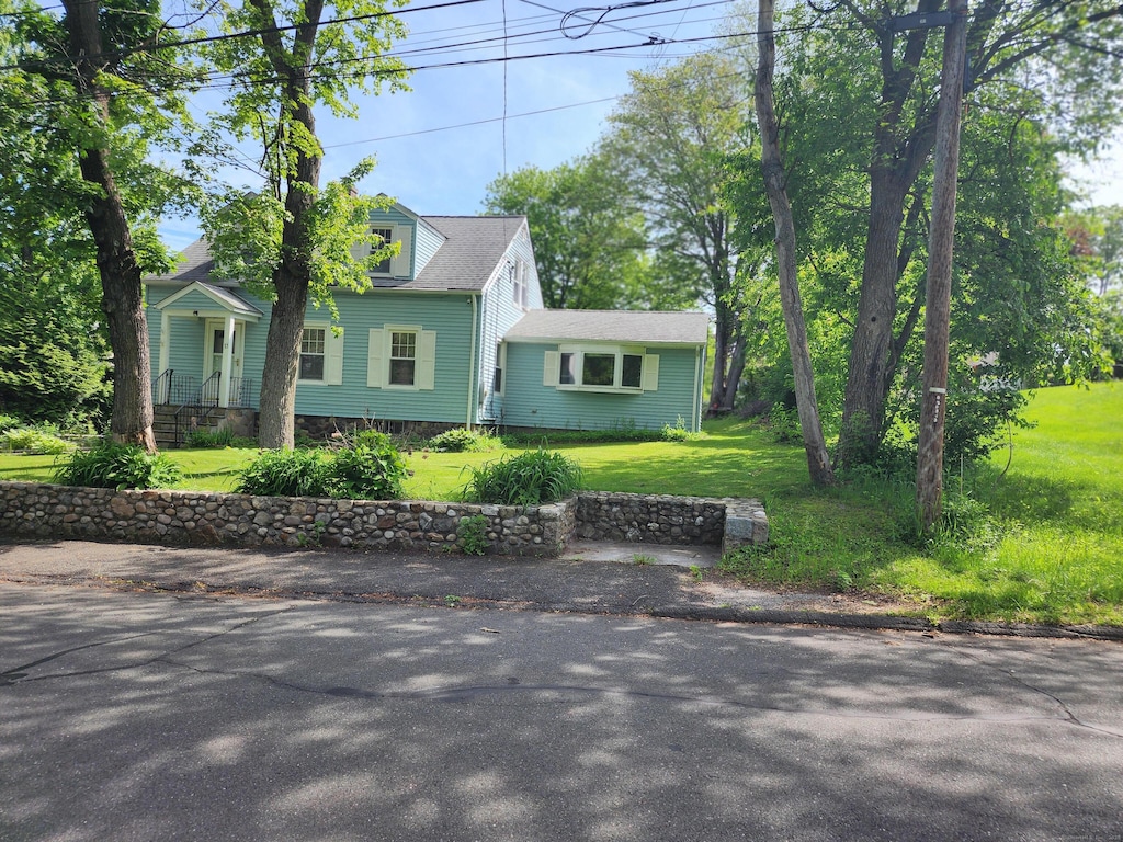 23 Capewell Ave, Watertown, CT 06779 - cape cod home featuring a front lawn