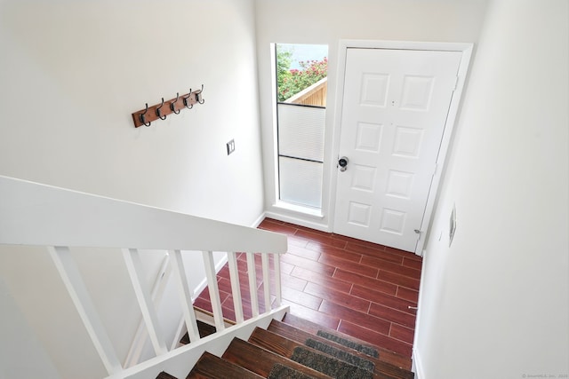 27 Pheasant Run Unit 27, Cromwell, CT 06416 - foyer with wood tiled floors, stairs, and baseboards