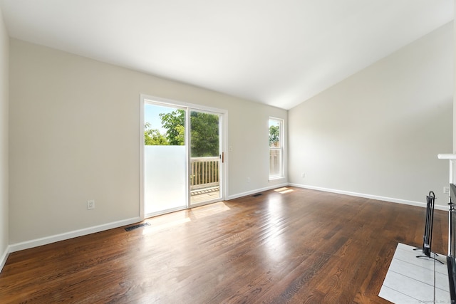 27 Pheasant Run Unit 27, Cromwell, CT 06416 - unfurnished living room featuring dark wood finished floors, baseboards, and lofted ceiling