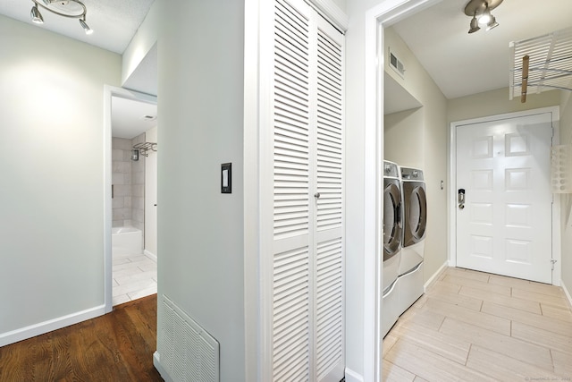 27 Pheasant Run Unit 27, Cromwell, CT 06416 - laundry room featuring washing machine and dryer and wood finished floors