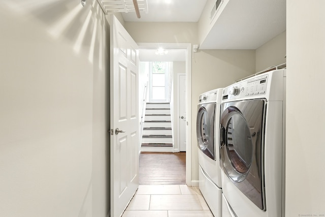 27 Pheasant Run Unit 27, Cromwell, CT 06416 - laundry area with washing machine and dryer and light tile patterned floors
