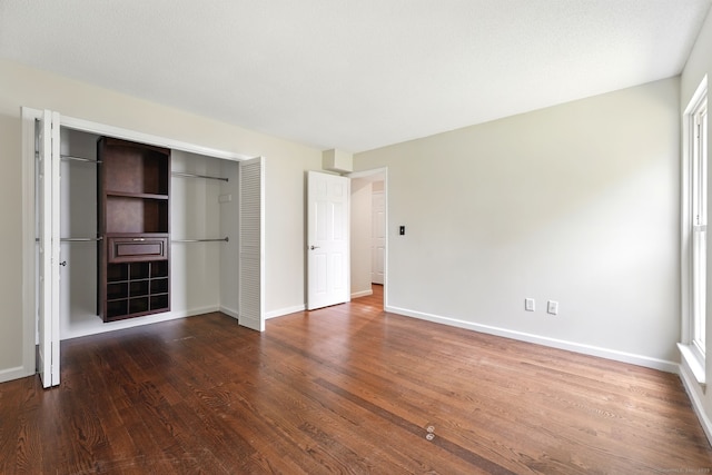 27 Pheasant Run Unit 27, Cromwell, CT 06416 - unfurnished bedroom featuring a closet, baseboards, and wood finished floors