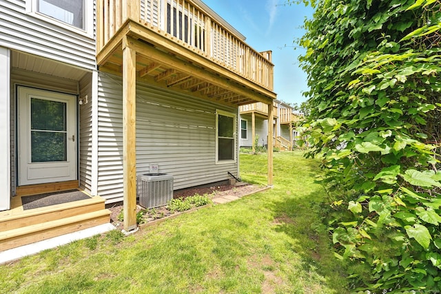 27 Pheasant Run Unit 27, Cromwell, CT 06416 - view of green lawn featuring central AC unit, entry steps, and a deck