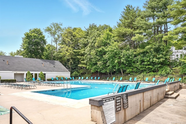 27 Pheasant Run Unit 27, Cromwell, CT 06416 - community pool featuring a patio area and view of wooded area