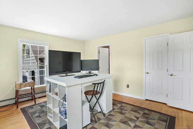 7 Silva Ter, Oxford, CT 06478 - home office with light wood finished floors, baseboards, and a baseboard heating unit