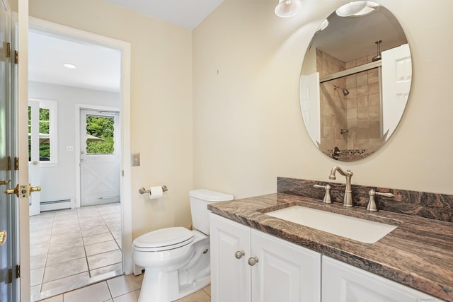 7 Silva Ter, Oxford, CT 06478 - bathroom featuring a baseboard heating unit, vanity, toilet, tiled shower, and tile patterned flooring