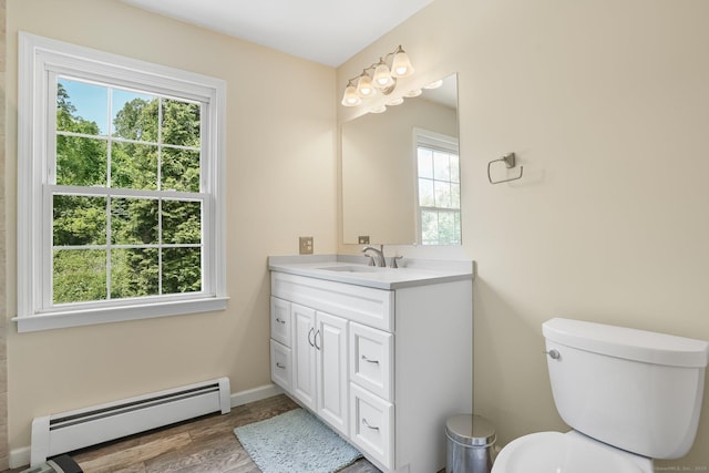 7 Silva Ter, Oxford, CT 06478 - bathroom with baseboard heating, healthy amount of natural light, vanity, and toilet
