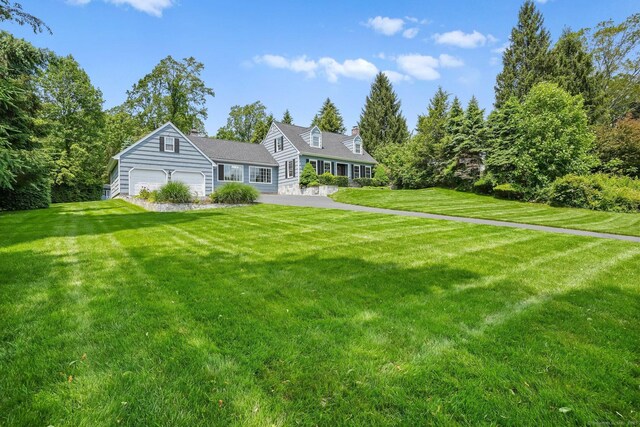 7 Silva Ter, Oxford, CT 06478 - back of property with an attached garage, a lawn, and driveway
