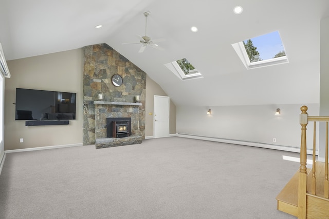 7 Silva Ter, Oxford, CT 06478 - unfurnished living room featuring a skylight, a baseboard radiator, vaulted ceiling, carpet, and ceiling fan