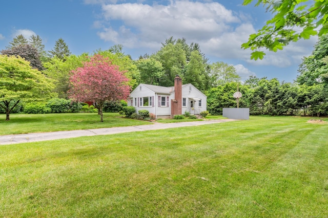 30 Fairlawn Rd, Glastonbury, CT 06033 - view of front of property featuring a chimney and a front yard
