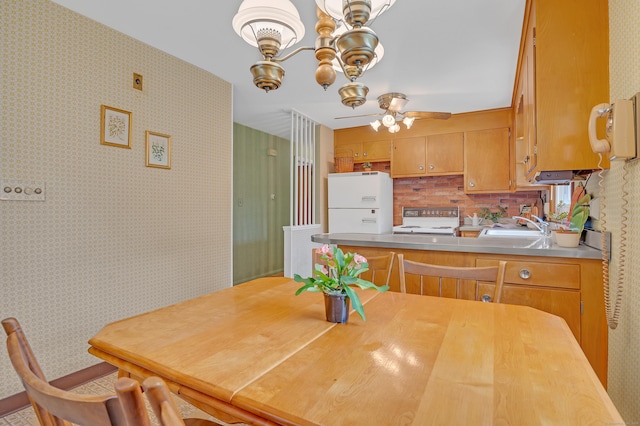 30 Fairlawn Rd, Glastonbury, CT 06033 - dining space with wallpapered walls, a chandelier, and ceiling fan