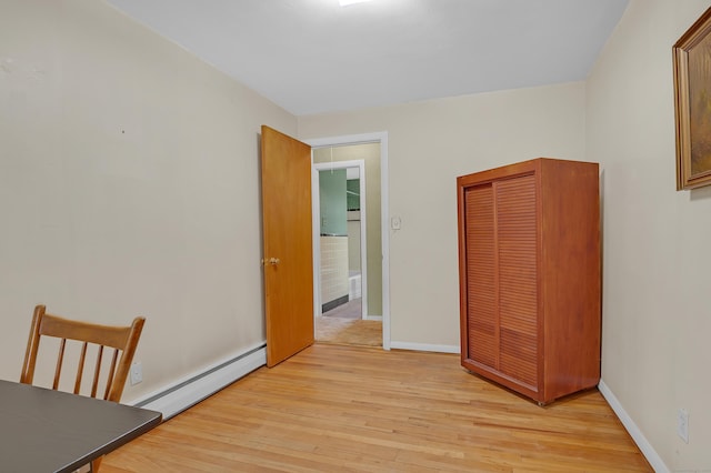 30 Fairlawn Rd, Glastonbury, CT 06033 - unfurnished bedroom featuring a baseboard heating unit, light wood-style flooring, and baseboards