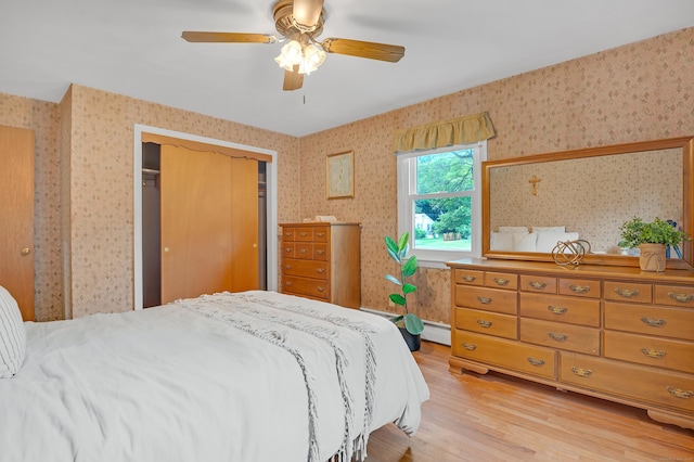30 Fairlawn Rd, Glastonbury, CT 06033 - bedroom with light wood-type flooring, wallpapered walls, baseboard heating, a closet, and ceiling fan