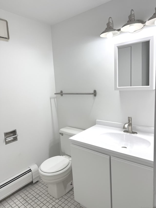 32 Pine St Unit 12Aka 15, Norwalk, CT 06854 - bathroom featuring baseboard heating, vanity, toilet, and tile patterned flooring