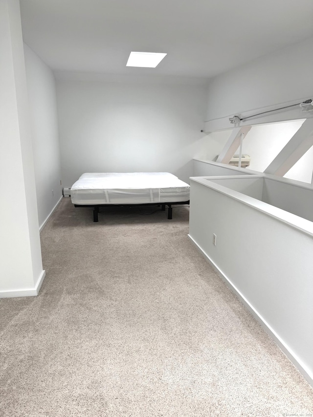 32 Pine St Unit 12Aka 15, Norwalk, CT 06854 - unfurnished bedroom featuring carpet flooring, baseboards, and a skylight