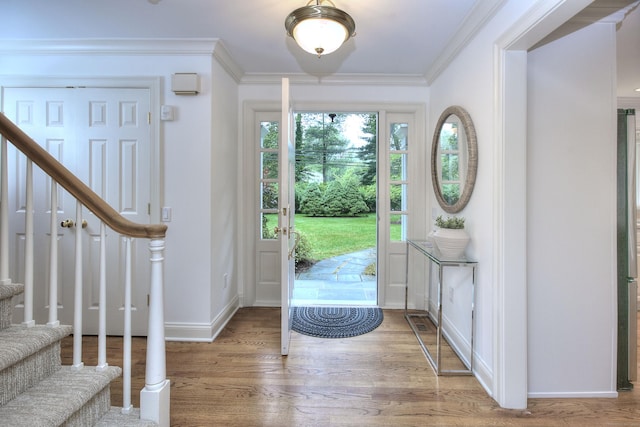 52 Woodside Ave, Westport, CT 06880 - foyer entrance with stairway, wood finished floors, and crown molding