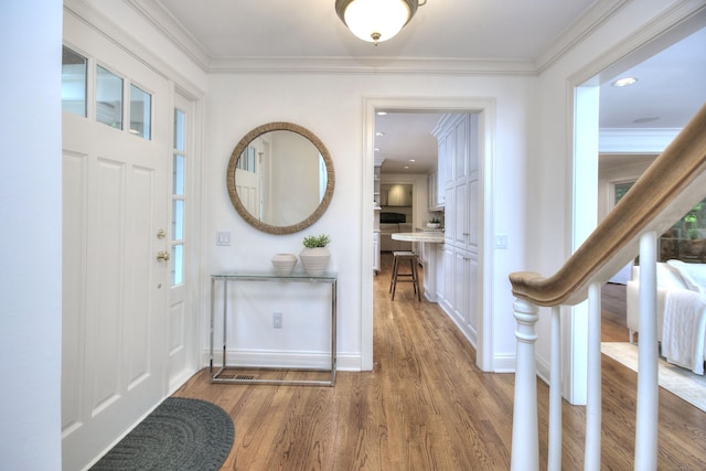 52 Woodside Ave, Westport, CT 06880 - entryway with wood finished floors and ornamental molding