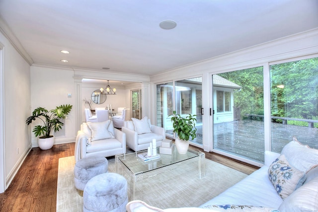 52 Woodside Ave, Westport, CT 06880 - living room with ornamental molding, plenty of natural light, wood finished floors, and a chandelier