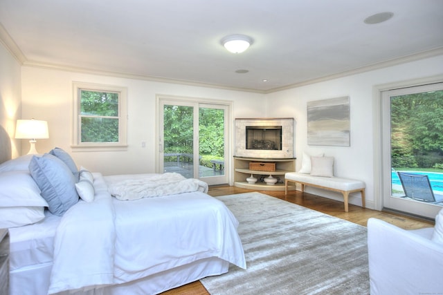 52 Woodside Ave, Westport, CT 06880 - bedroom featuring ornamental molding, access to outside, and wood finished floors