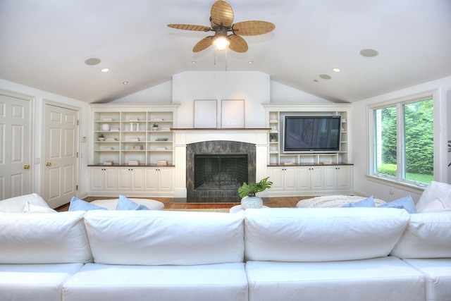 52 Woodside Ave, Westport, CT 06880 - living area featuring vaulted ceiling, ceiling fan, built in shelves, recessed lighting, and a fireplace