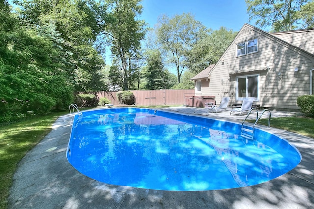 52 Woodside Ave, Westport, CT 06880 - view of pool with a fenced backyard, a hot tub, and a patio