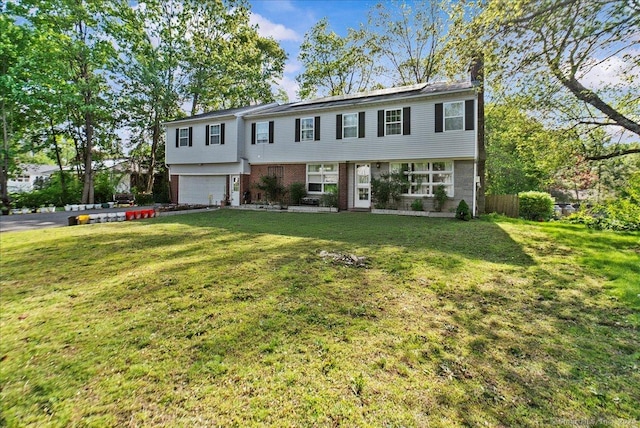 146 Whitewood Rd, Torrington, CT 06790 - colonial home with a chimney, an attached garage, and brick siding