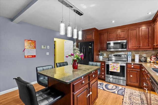146 Whitewood Rd, Torrington, CT 06790 - kitchen featuring black appliances, light wood-type flooring, backsplash, a breakfast bar area, and beam ceiling