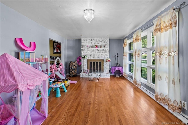 146 Whitewood Rd, Torrington, CT 06790 - living area featuring wood finished floors and a brick fireplace