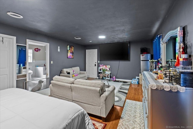 146 Whitewood Rd, Torrington, CT 06790 - bedroom featuring wood finished floors, recessed lighting, baseboards, and ensuite bath
