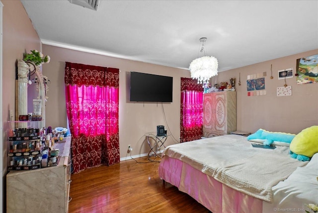146 Whitewood Rd, Torrington, CT 06790 - bedroom featuring wood finished floors and a chandelier