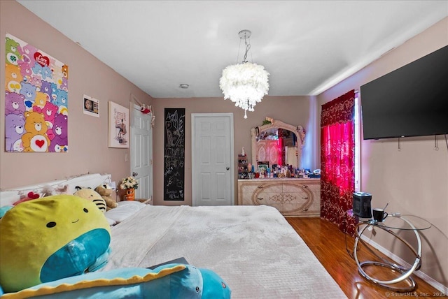 146 Whitewood Rd, Torrington, CT 06790 - bedroom with wood finished floors and a chandelier