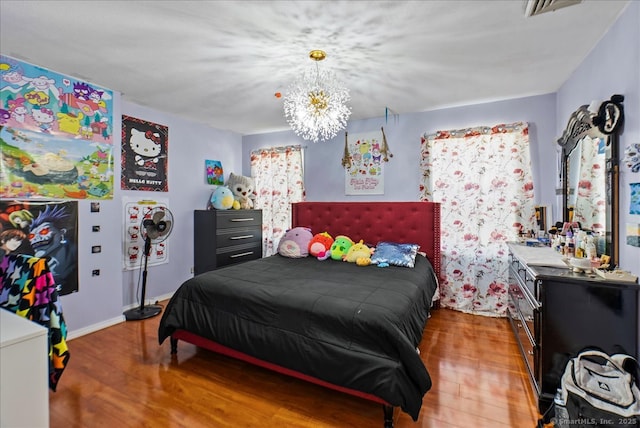 146 Whitewood Rd, Torrington, CT 06790 - bedroom featuring wood finished floors, a chandelier, and baseboards