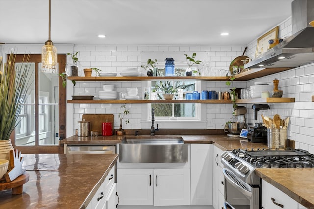 11 Pearl St, Groton, CT 06340 - kitchen featuring appliances with stainless steel finishes, open shelves, a sink, wall chimney range hood, and decorative backsplash
