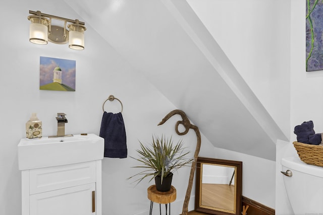 11 Pearl St, Groton, CT 06340 - bathroom with lofted ceiling, toilet, and vanity