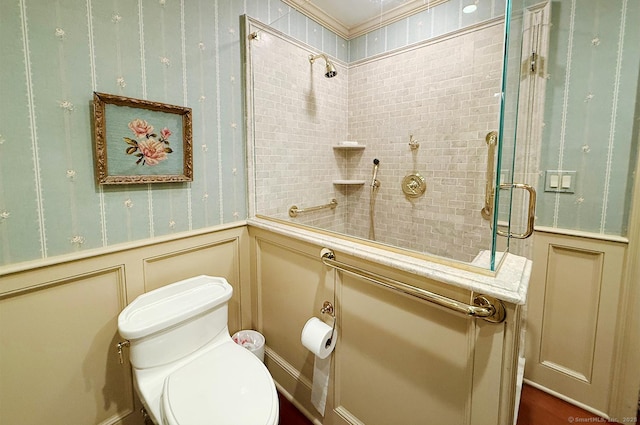 3200 Park Ave Unit 10A1, Bridgeport, CT 06604 - bathroom with wainscoting, toilet, a decorative wall, and a tile shower