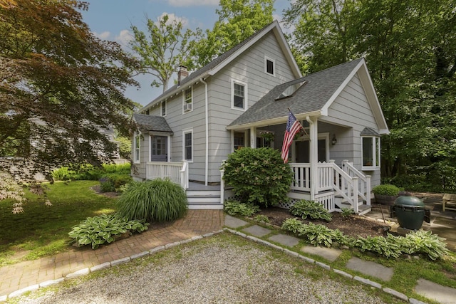 102 Rose Ln, Darien, CT 06820 - view of front of house with a shingled roof, a chimney, and a porch
