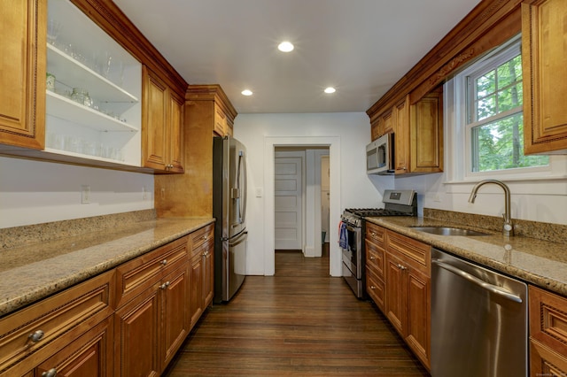 102 Rose Ln, Darien, CT 06820 - kitchen featuring appliances with stainless steel finishes, a sink, dark wood-style flooring, recessed lighting, and light stone countertops
