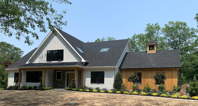 10 Singing Woods Rd, Norwalk, CT 06850 - modern farmhouse style home with board and batten siding and a shingled roof