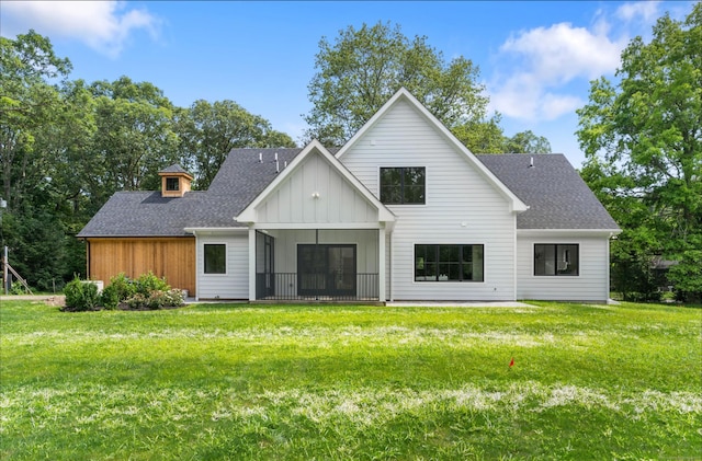 10 Singing Woods Rd, Norwalk, CT 06850 - back of house featuring board and batten siding, a shingled roof, and a yard