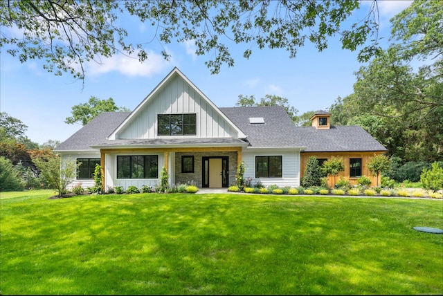 10 Singing Woods Rd, Norwalk, CT 06850 - modern inspired farmhouse featuring a front lawn, board and batten siding, and roof with shingles