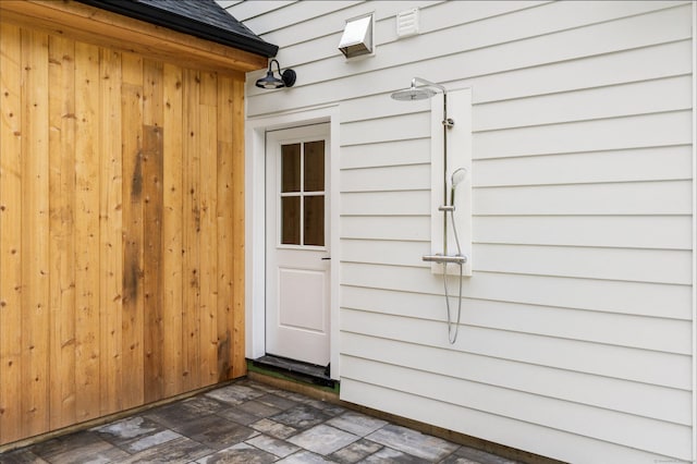 10 Singing Woods Rd, Norwalk, CT 06850 - view of exterior entry featuring roof with shingles