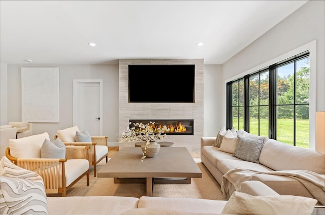10 Singing Woods Rd, Norwalk, CT 06850 - living area featuring a large fireplace, light wood-type flooring, and recessed lighting