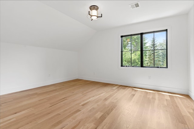 10 Singing Woods Rd, Norwalk, CT 06850 - bonus room with light wood-style flooring and lofted ceiling