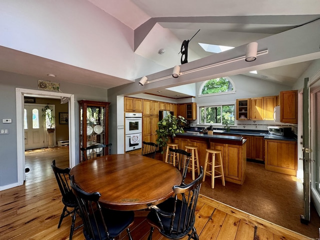 10 Laurel Trl, Durham, CT 06422 - dining area with plenty of natural light, light wood finished floors, a skylight, and high vaulted ceiling