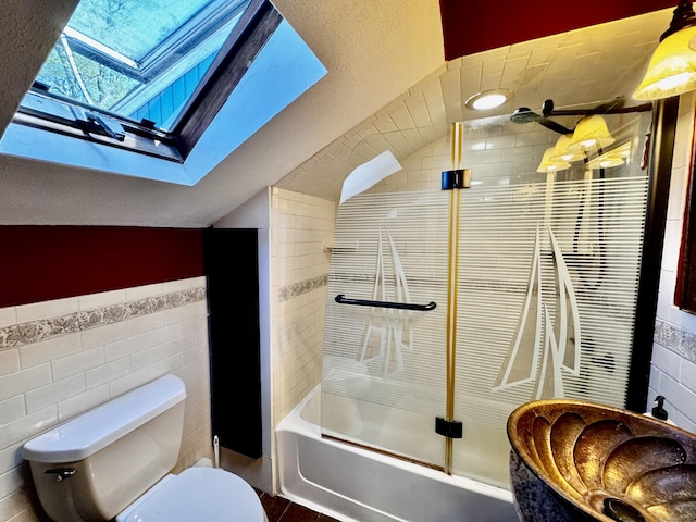 10 Laurel Trl, Durham, CT 06422 - bathroom with tile walls, a skylight, toilet, enclosed tub / shower combo, and lofted ceiling