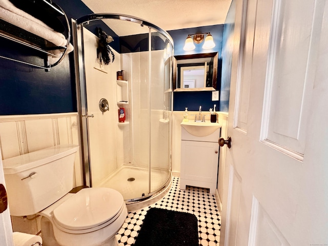10 Laurel Trl, Durham, CT 06422 - full bathroom with vanity, a shower stall, a wainscoted wall, and toilet