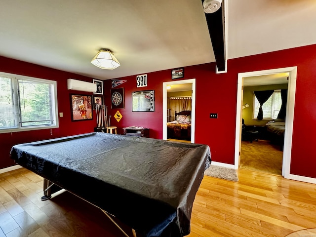10 Laurel Trl, Durham, CT 06422 - recreation room with a wall mounted air conditioner, light wood-type flooring, pool table, and baseboards