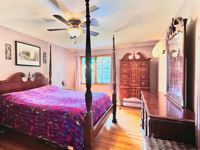 10 Laurel Trl, Durham, CT 06422 - bedroom featuring a wall mounted air conditioner, baseboard heating, wood finished floors, and ceiling fan