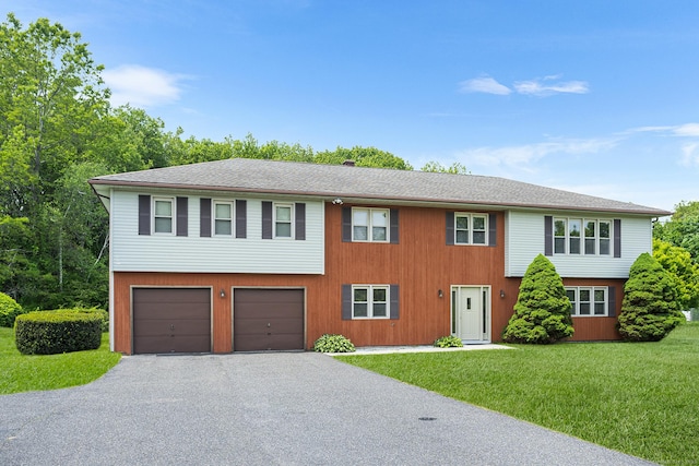 1441 Woodtick Rd, Wolcott, CT 06716 - multi unit property with driveway, a front yard, and a garage